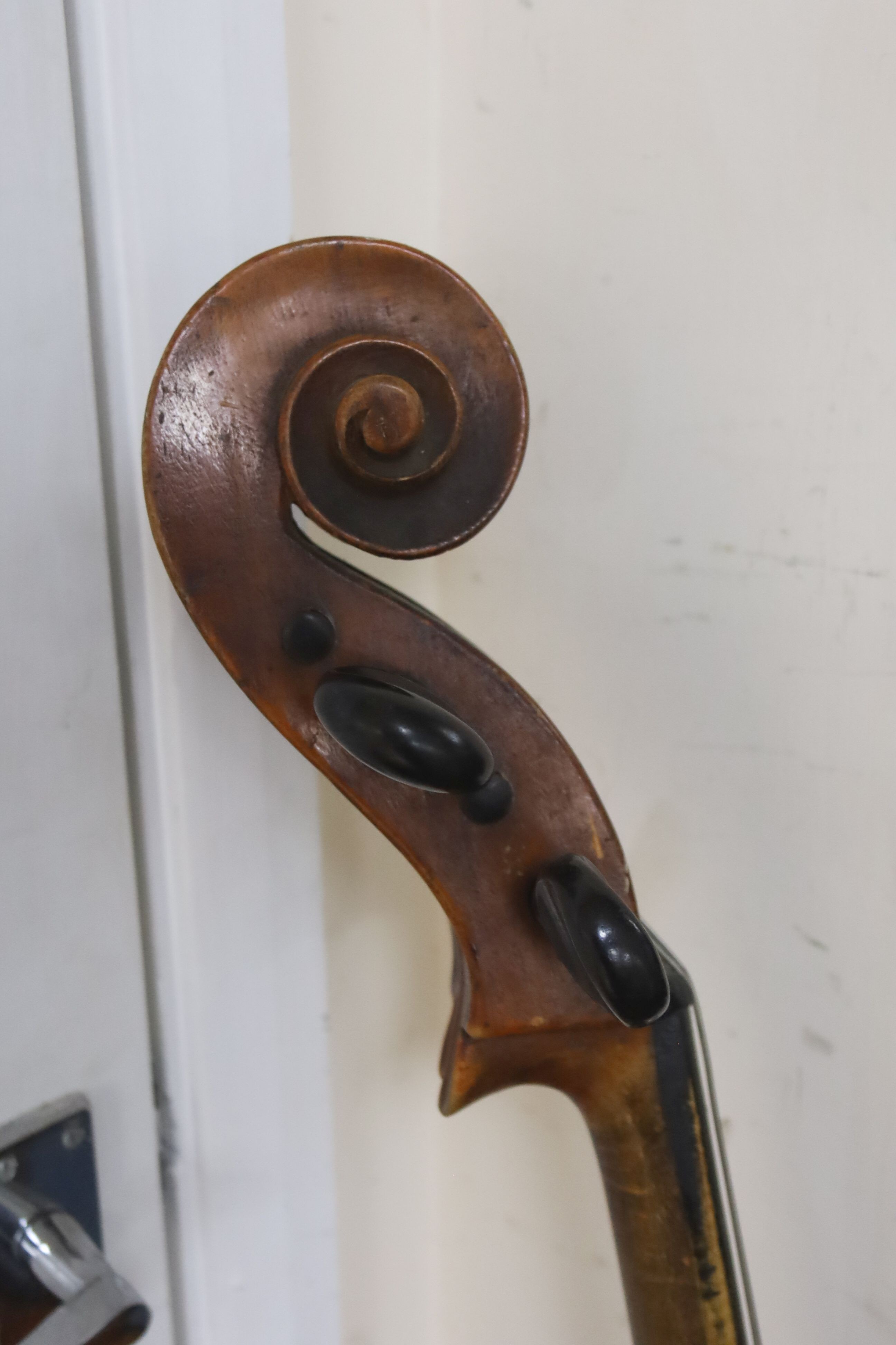 Early 20th century German cello and bow, the back measuring 75cm excluding the button